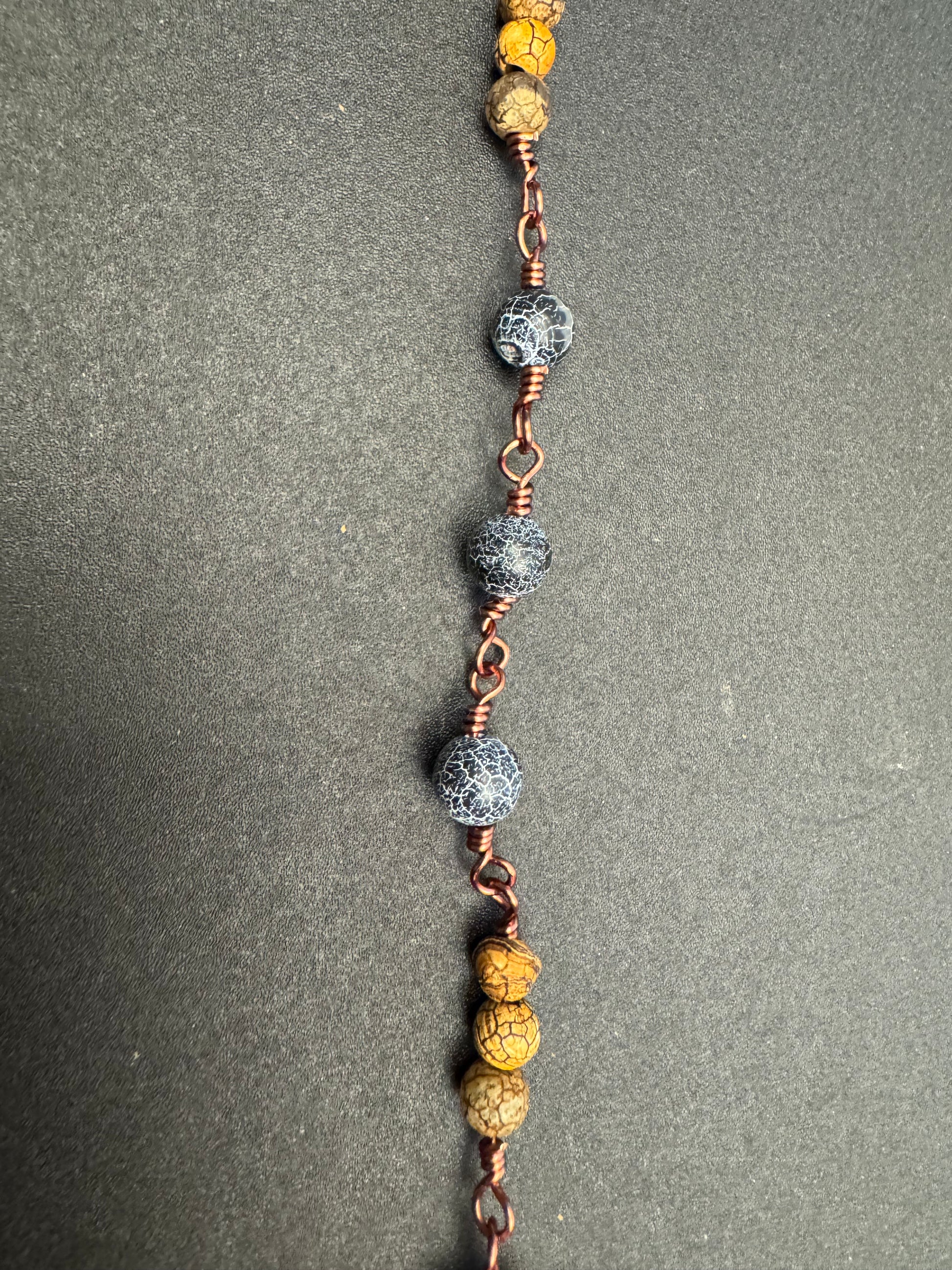 zoom in on blue matte jasper beads on single decade rosary