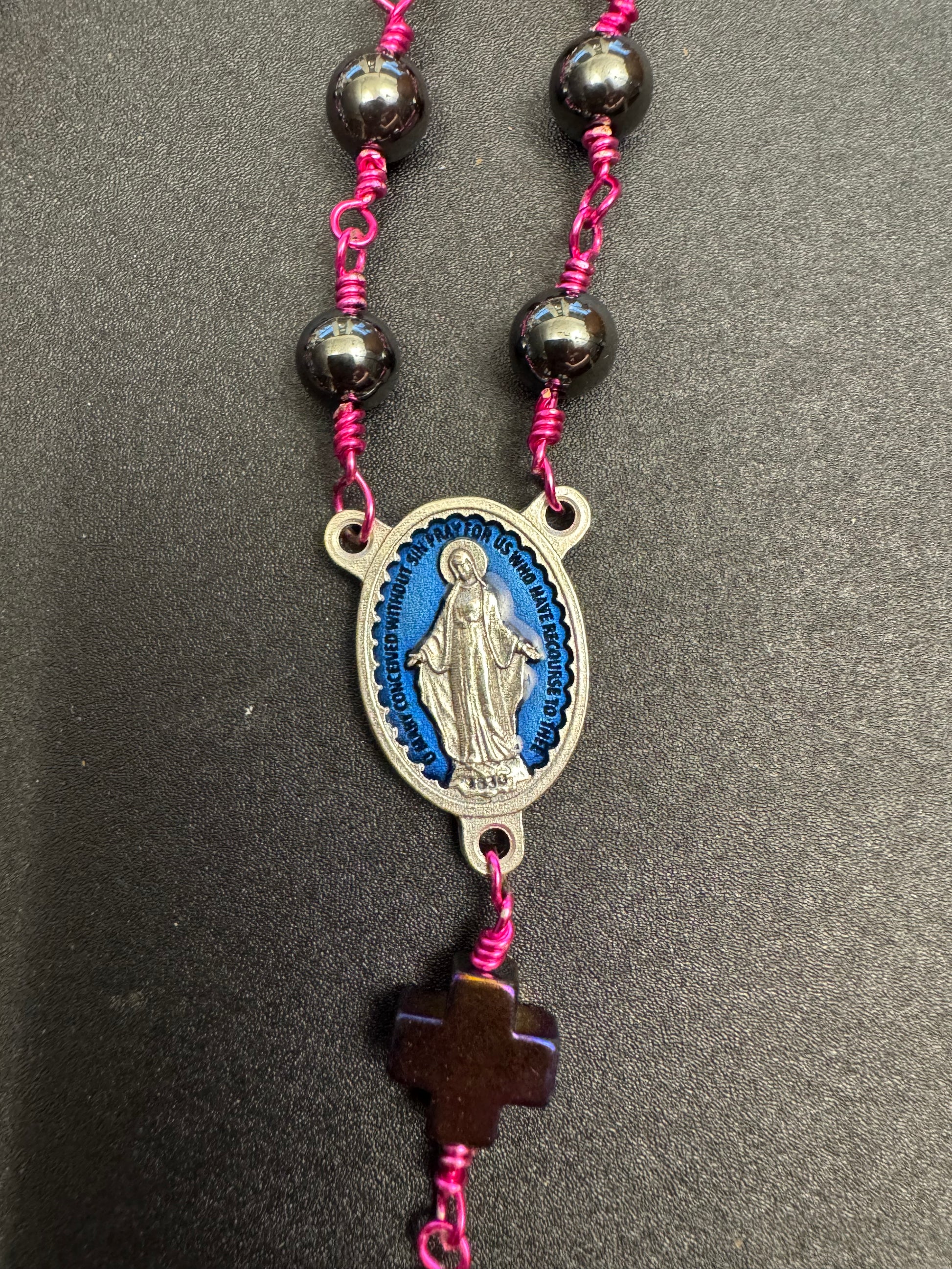 Blue miraculous medal centerpiece on full size rosary with hematite beads and fuchsia colored wire