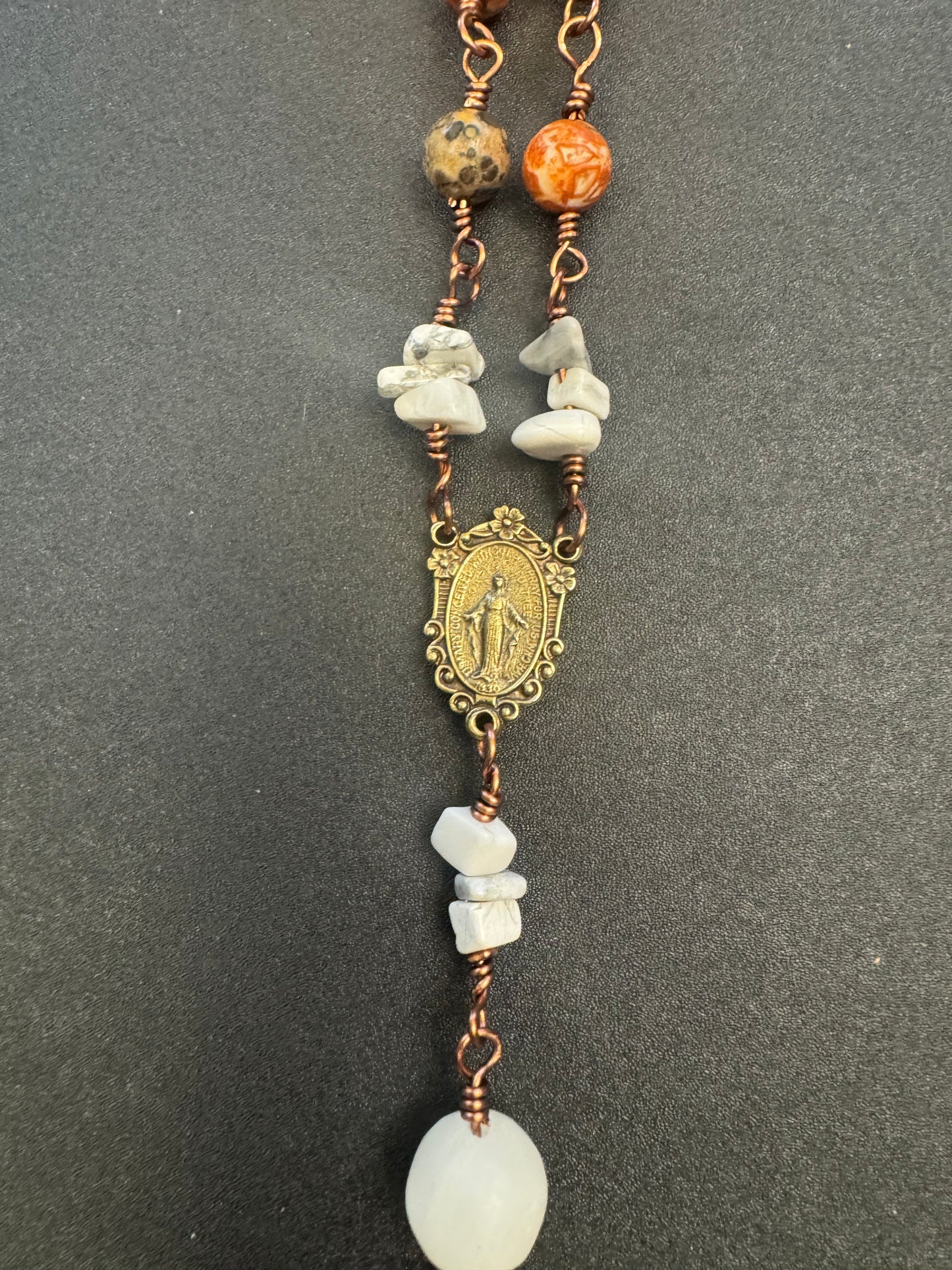 bronze centerpiece of Mary on brown agate single decade rosary