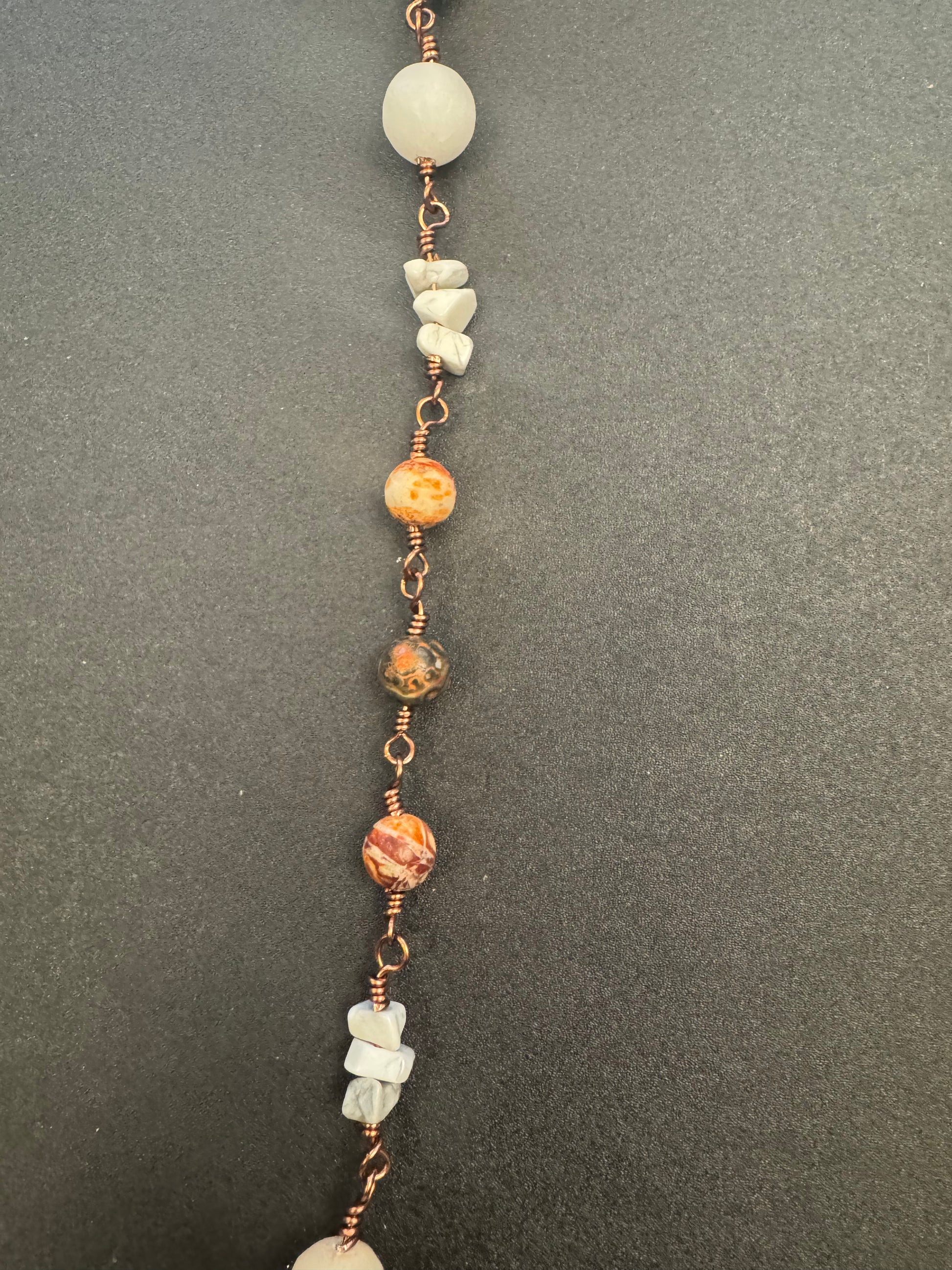 Closeup of brown agate beads on single decade rosary