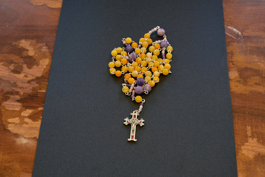 orange and purple frosted bead rosary with red crucifix