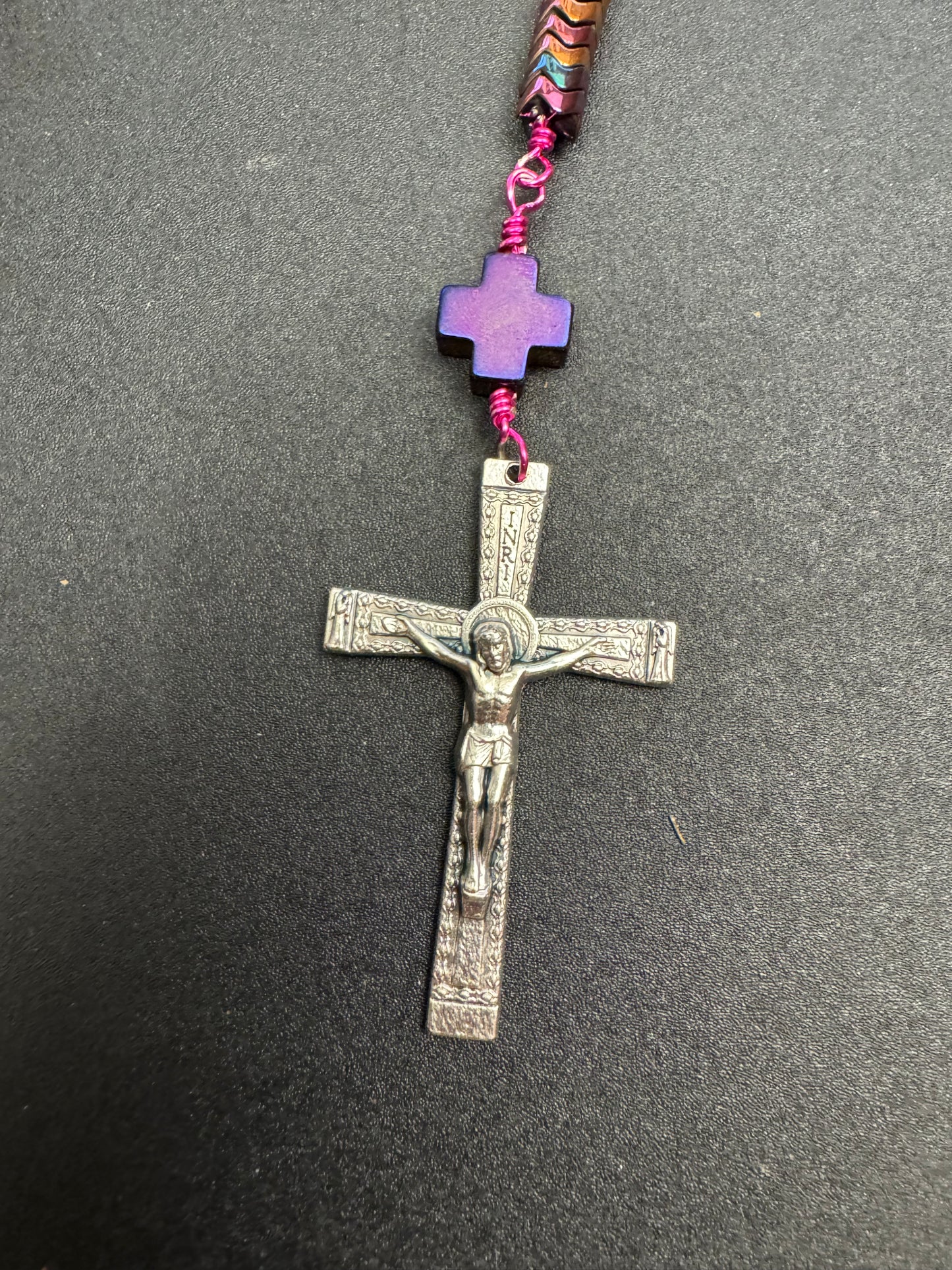 Crucifix on full size rosary with hematite beads and fuchsia colored wire and miraculous medal centerpiece