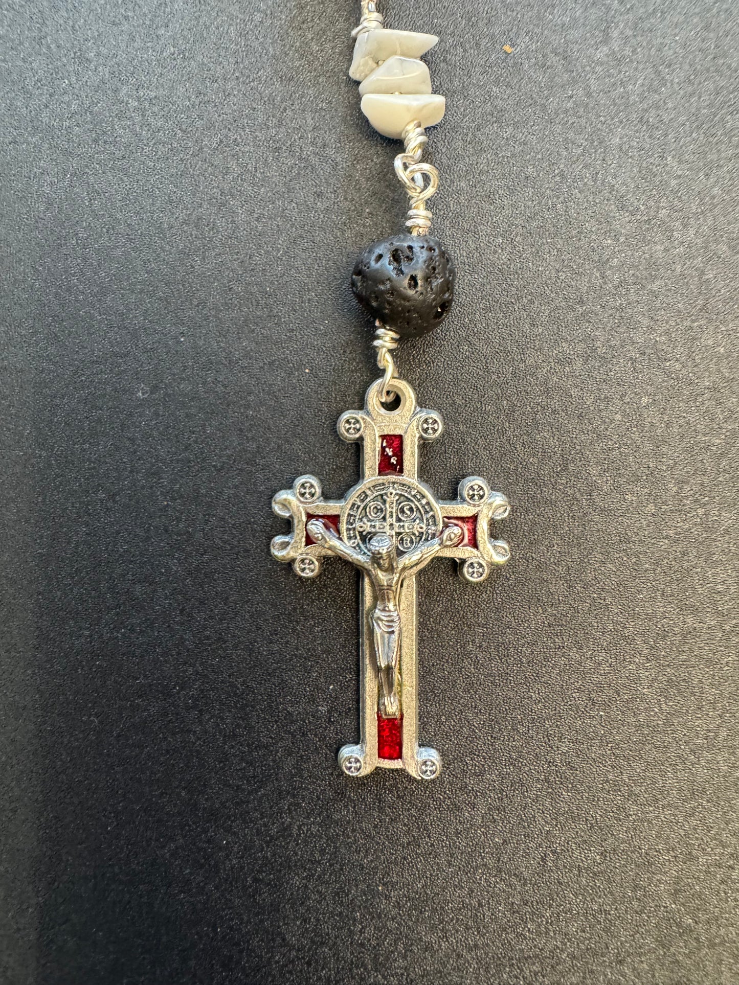 Red accented crucifix on St. Maria Goretti red stone bead pocket rosary