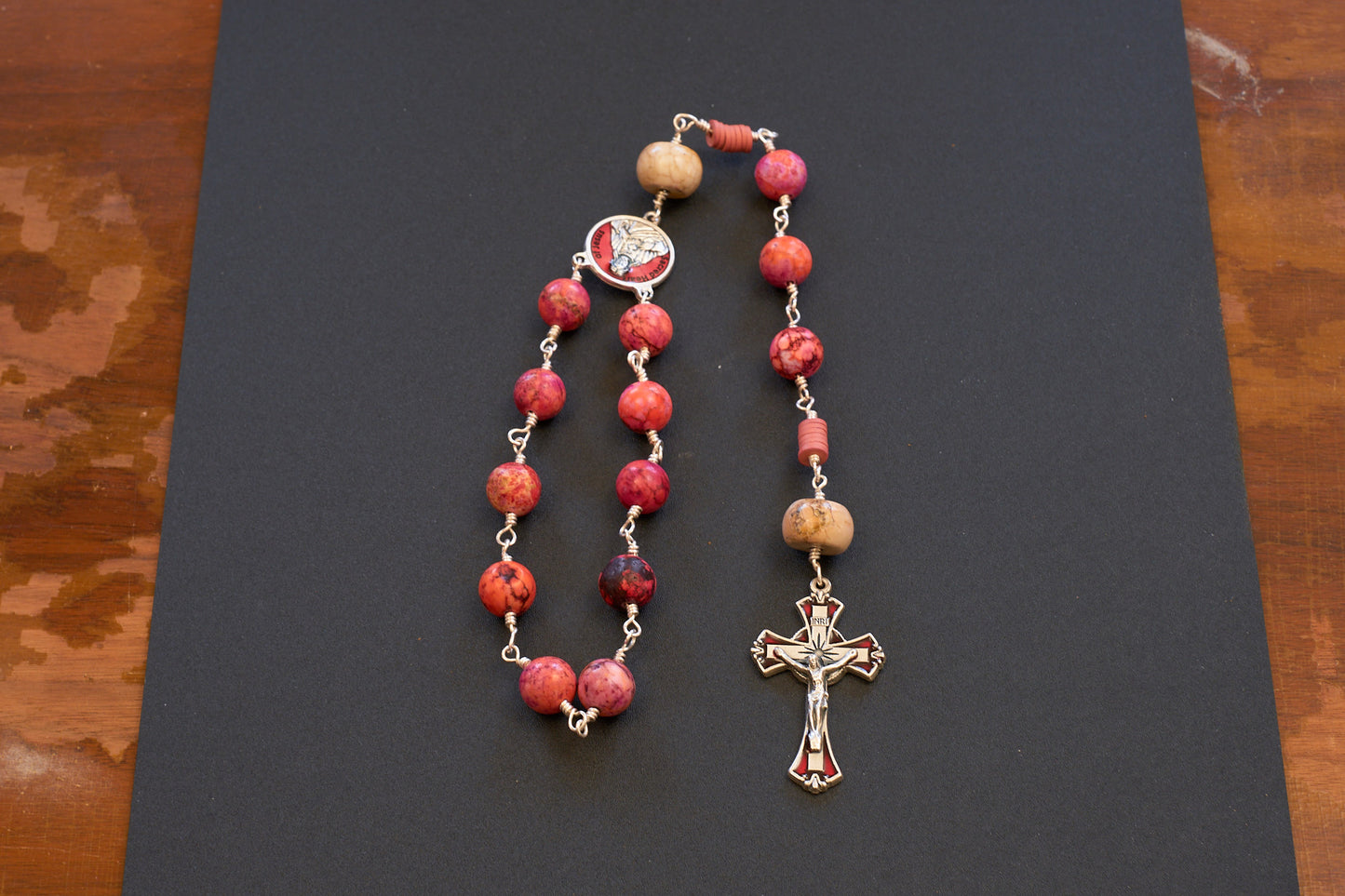 Sacred heart of Jesus single decade rosary with pinkish orange beads and red accented crucifix