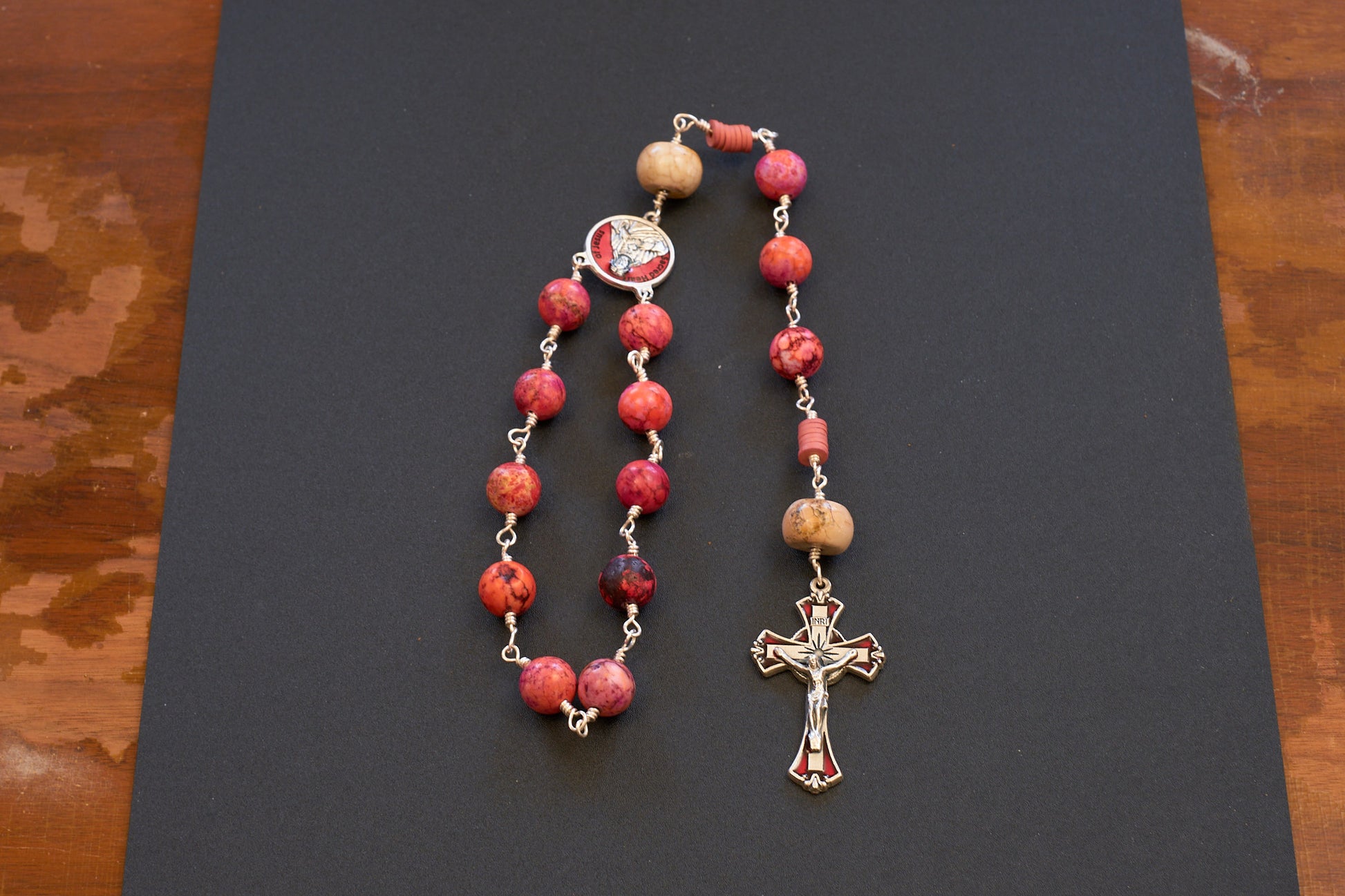 Sacred heart of Jesus single decade rosary with pinkish orange beads and red accented crucifix