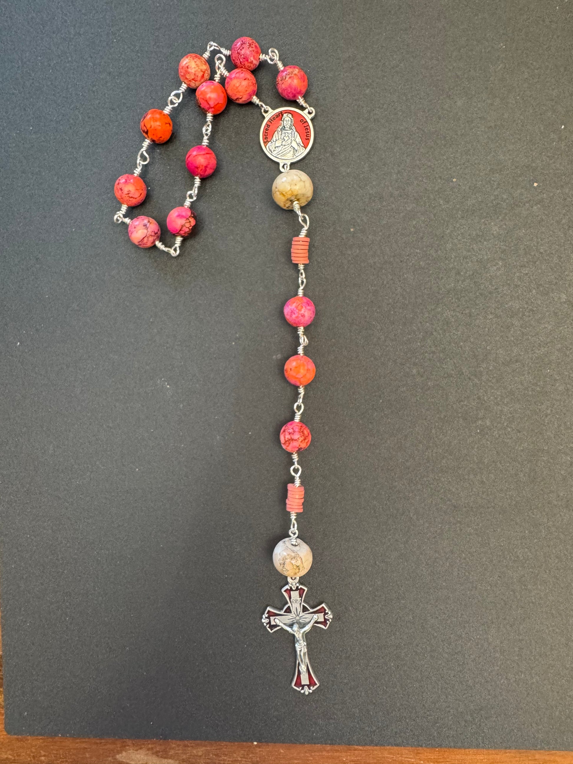 Sacred heart of Jesus single decade rosary with pinkish orange beads and red accented crucifix