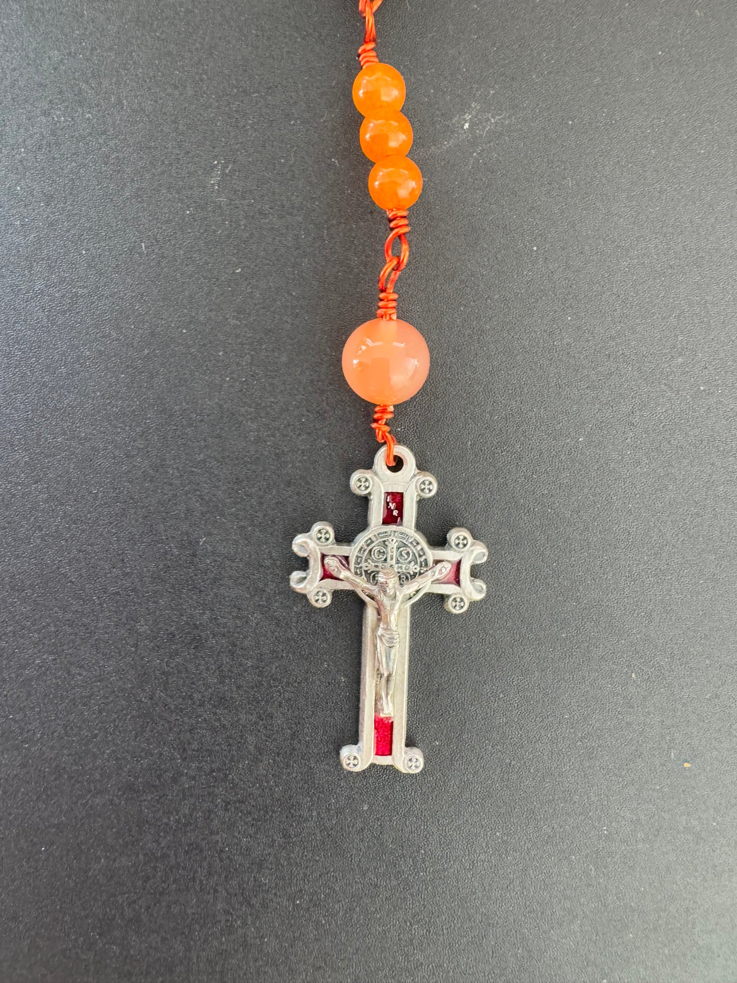 St. Benedict crucifix on holy family orange glass bead rosary