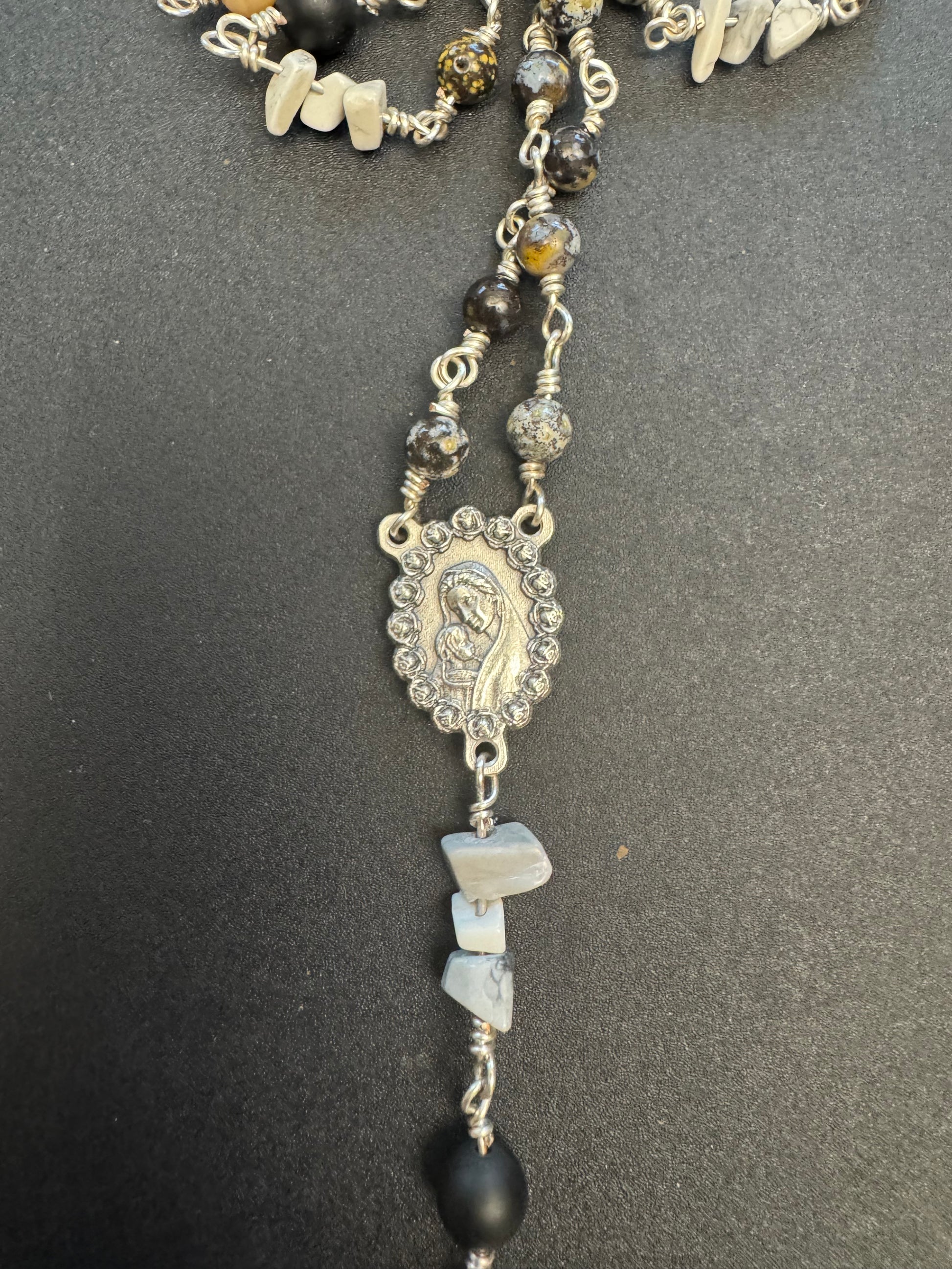 Centerpiece on full size rosary with gray and black stone beads