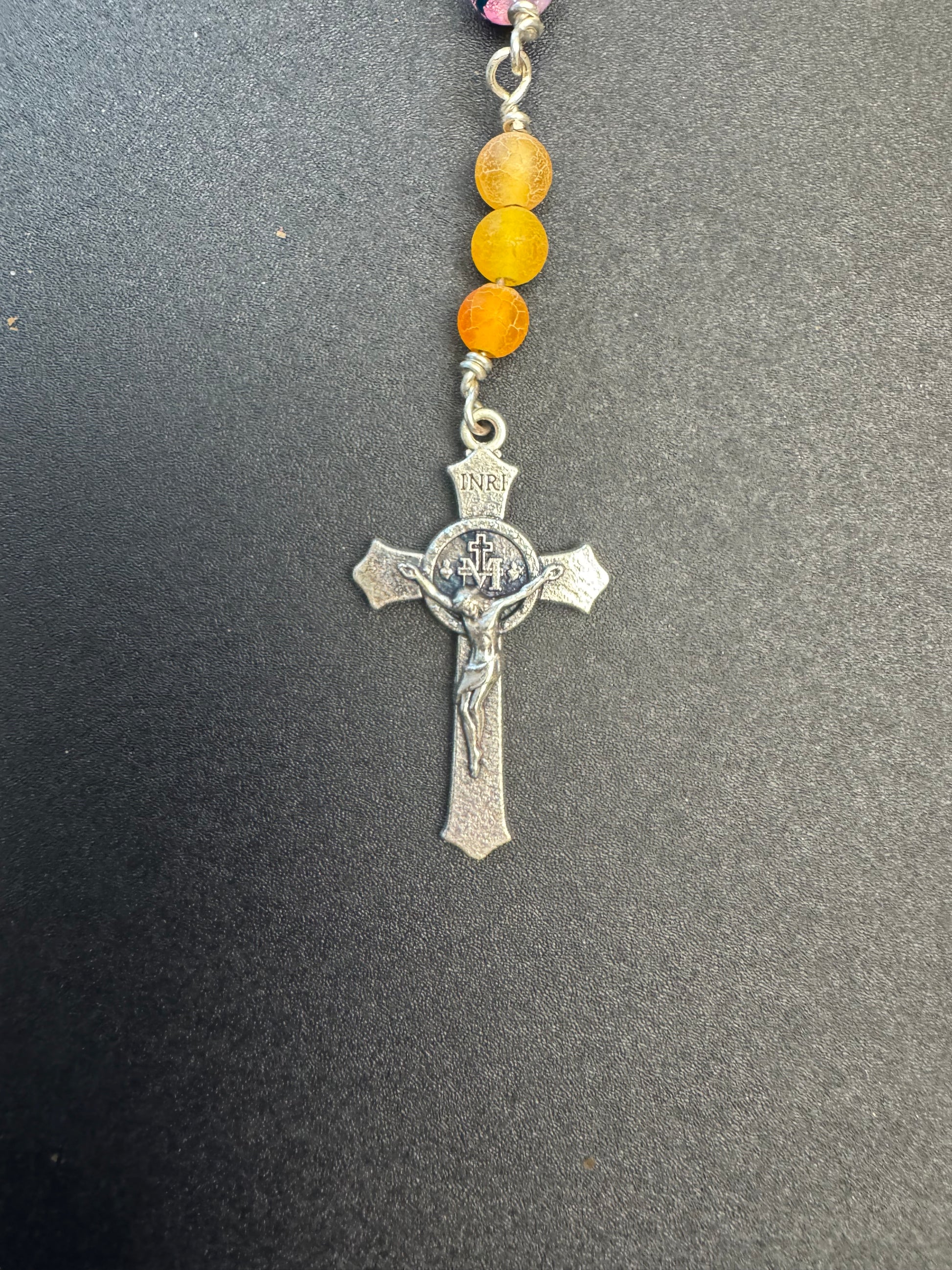 Crucifix on full size rosary with multicolored glass and orange agate beads