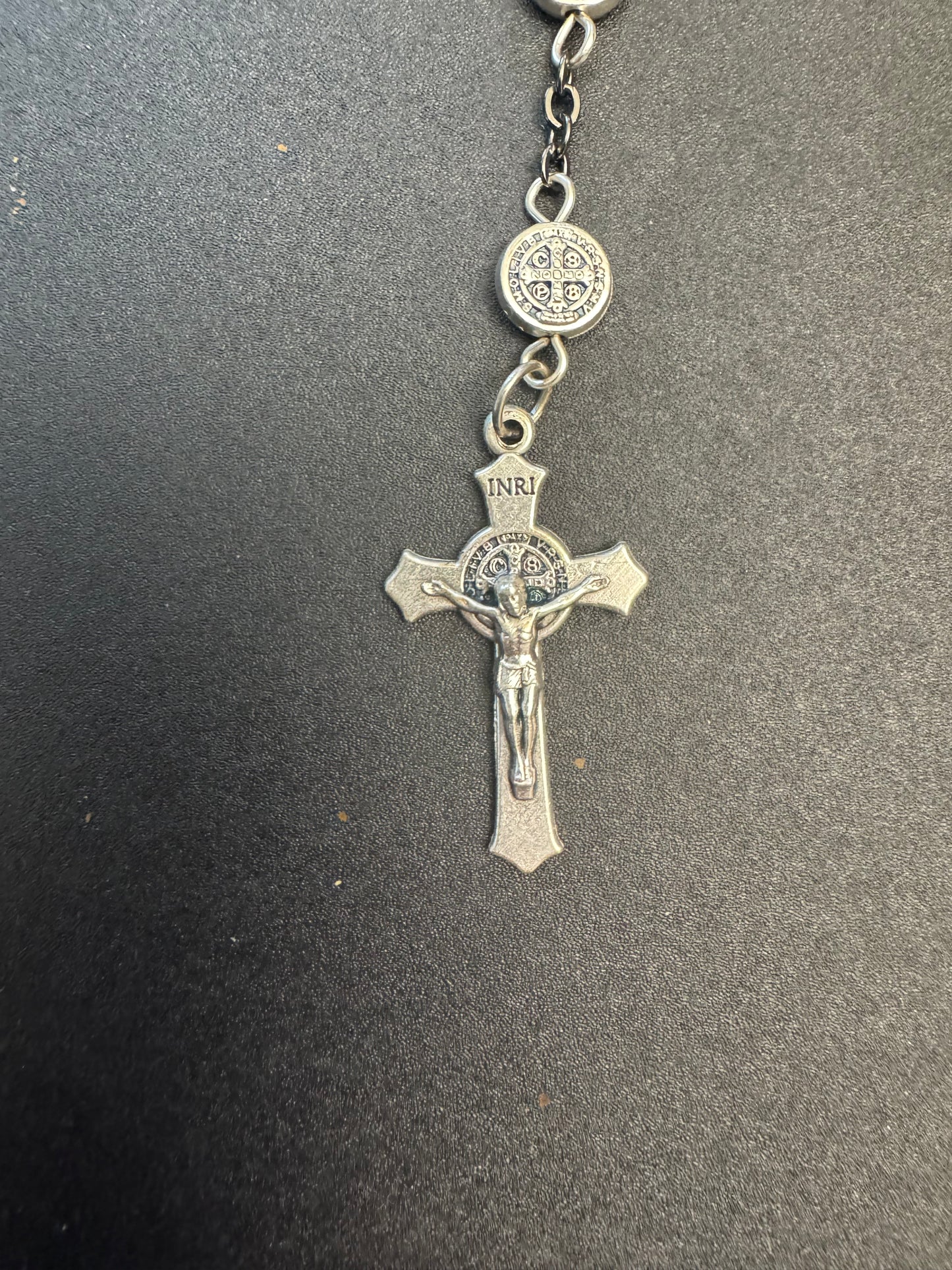 Crucifix on full size rosary with frosted hematite cross beads and st. Benedict medal beads