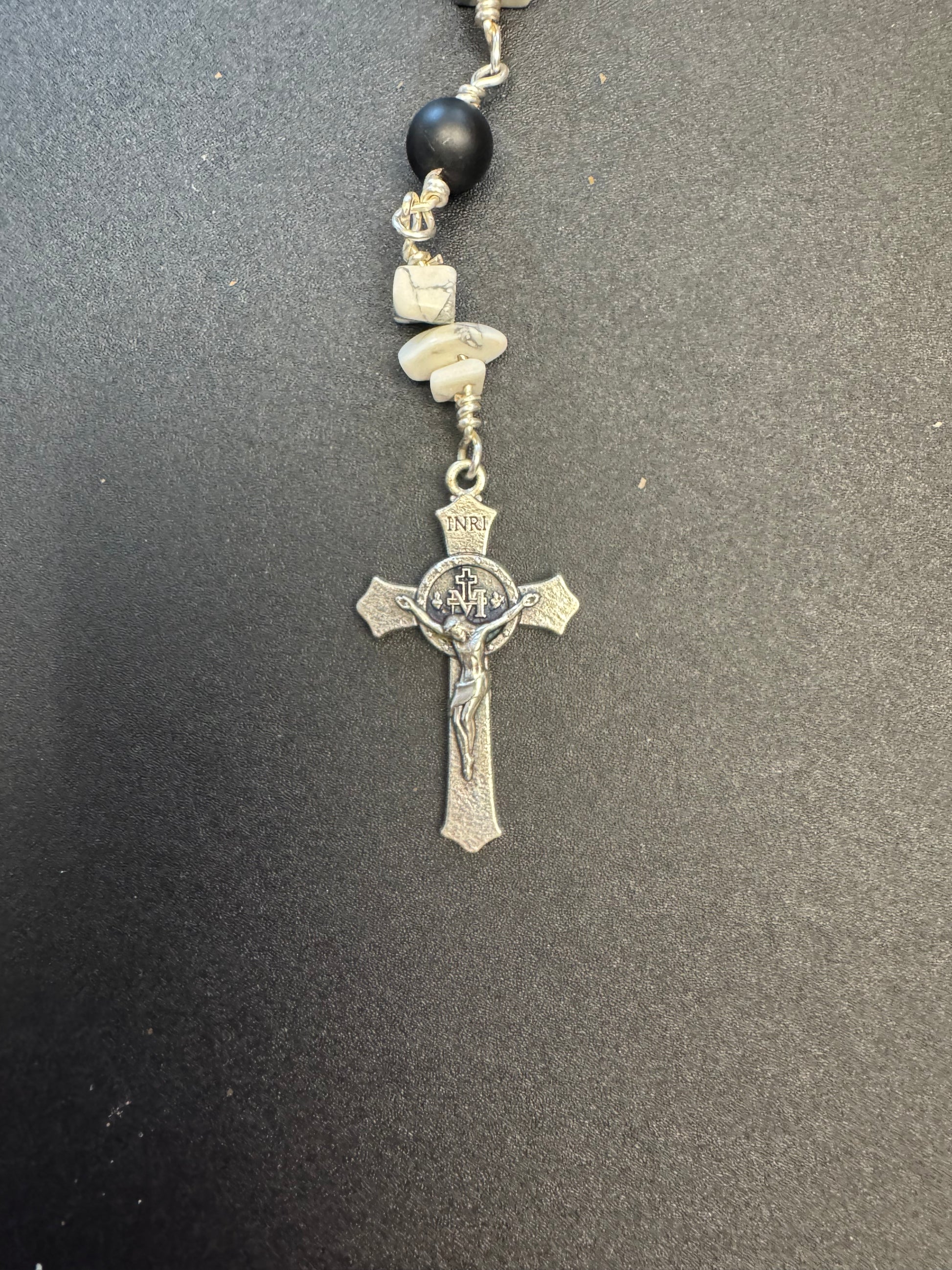 Crucifix on St. Bridget pocket rosary With black matte beads
