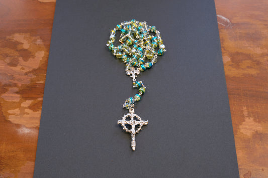Blue and green swirl glass bead rosary with crown of thorns crucifix and fleur de lis centerpiece