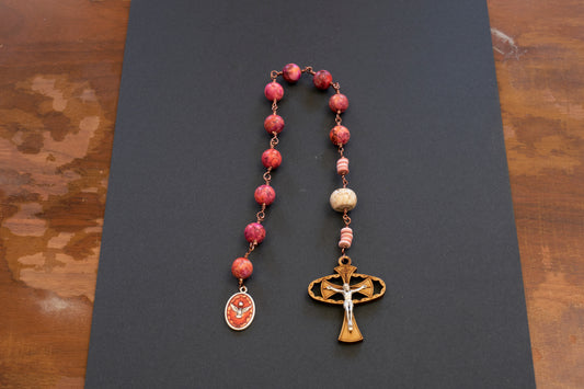 Holy Spirit Pocket Rosary with pinkish orange beads and wooden crucifix